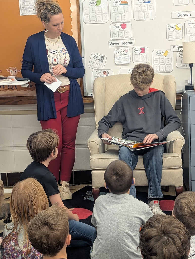 student reading to student