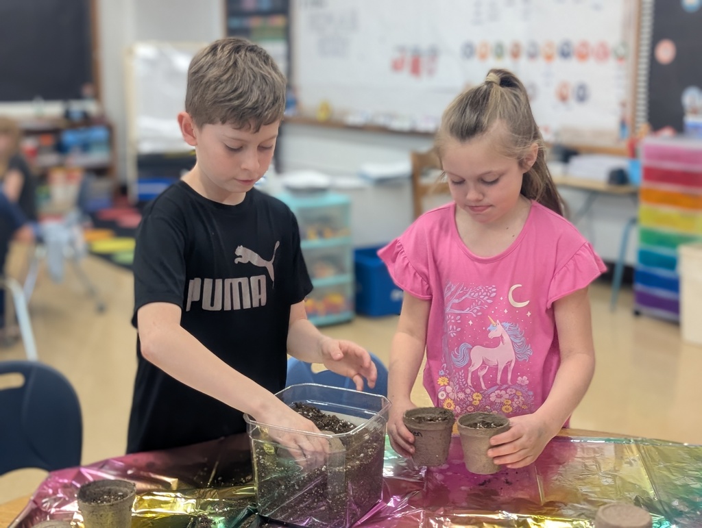 students packing dirt