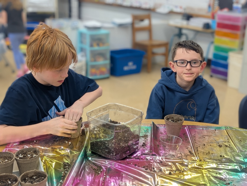 students packing dirt