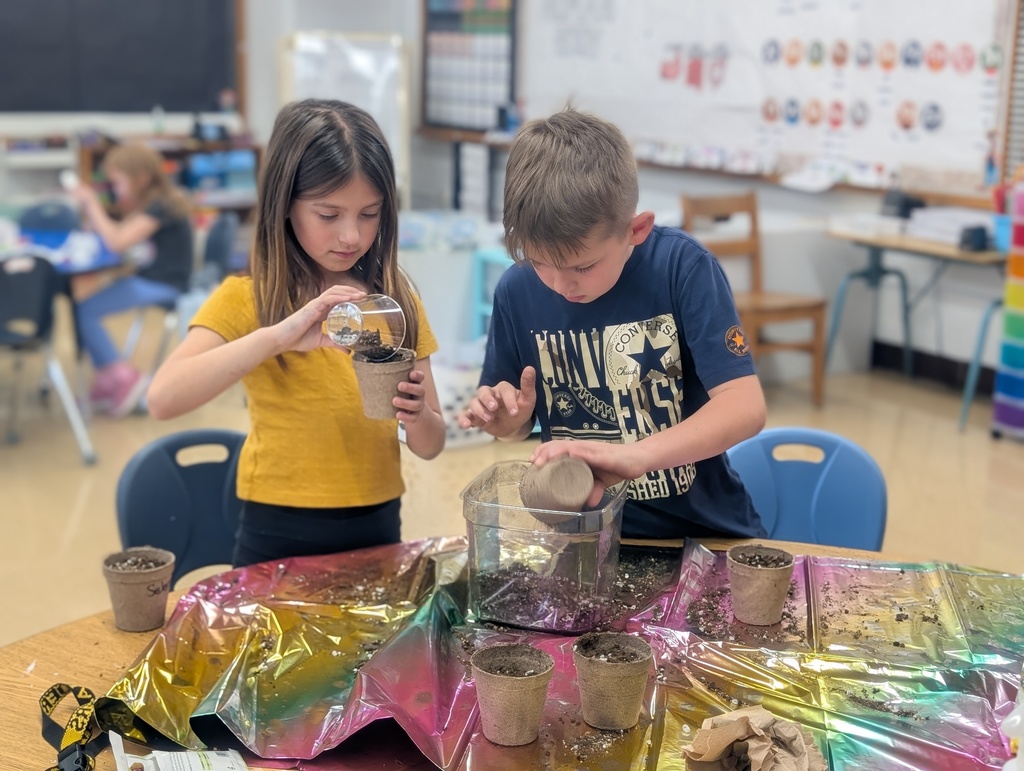 students packing dirt