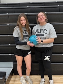two female students at bowling alley