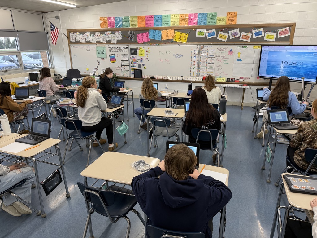 students in classroom sitting at desks testing