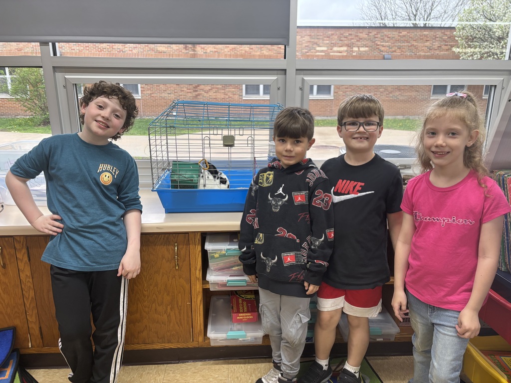 Students posing with bunny