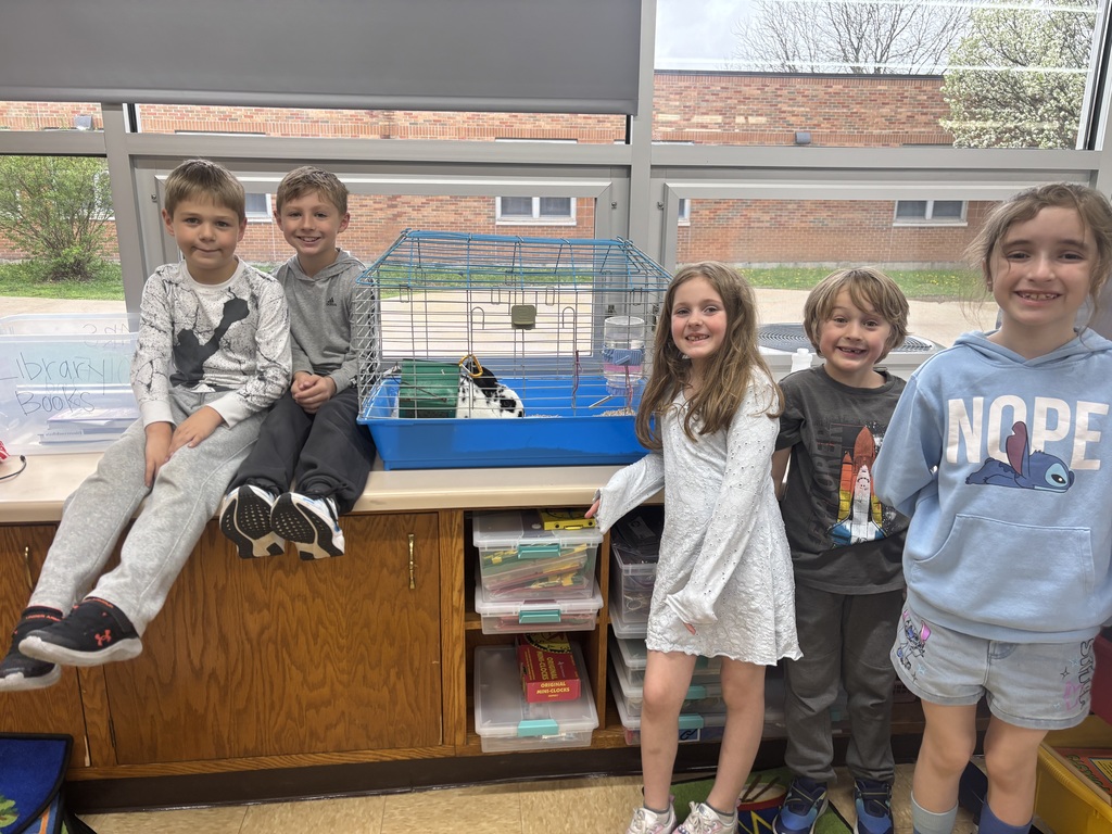 Students posing with bunny
