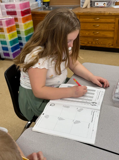 student working in workbook