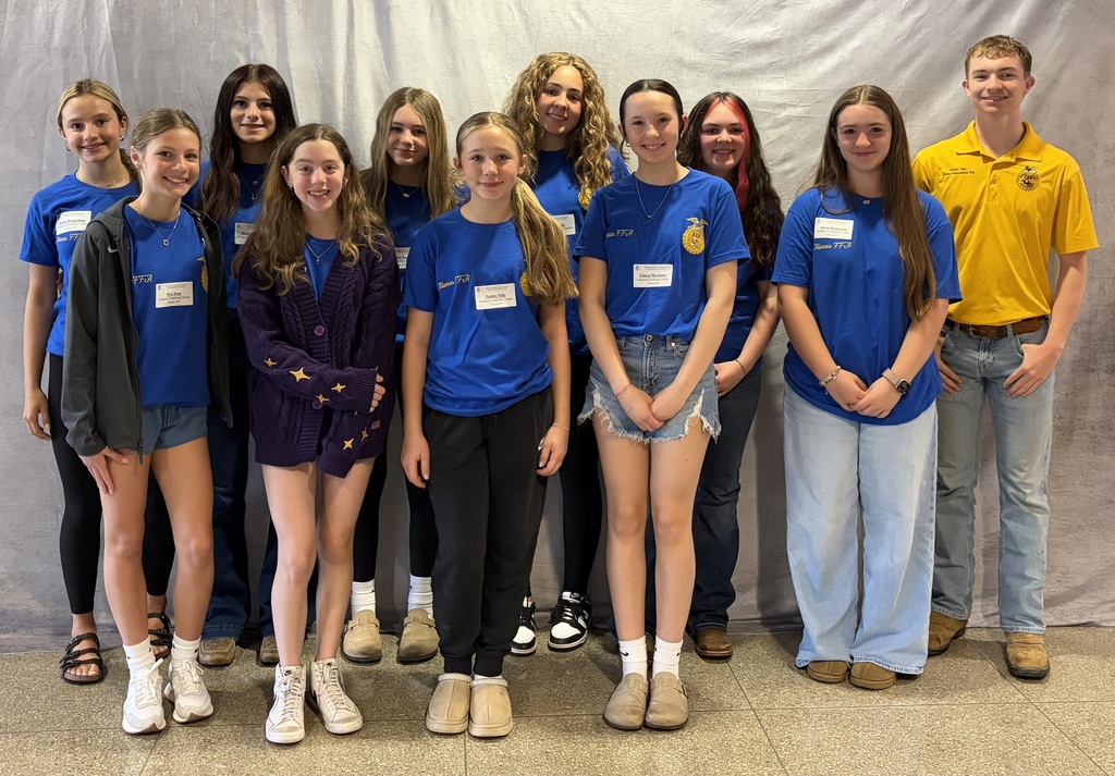 All ten students posing and smiling