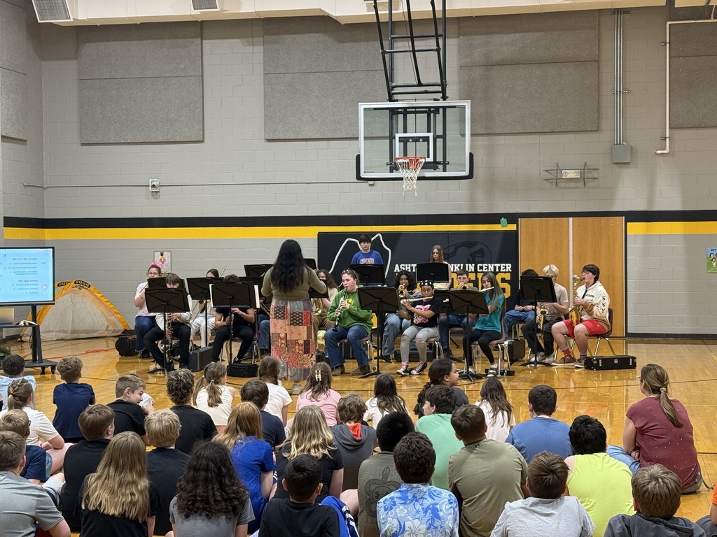 large group of students watching students perform