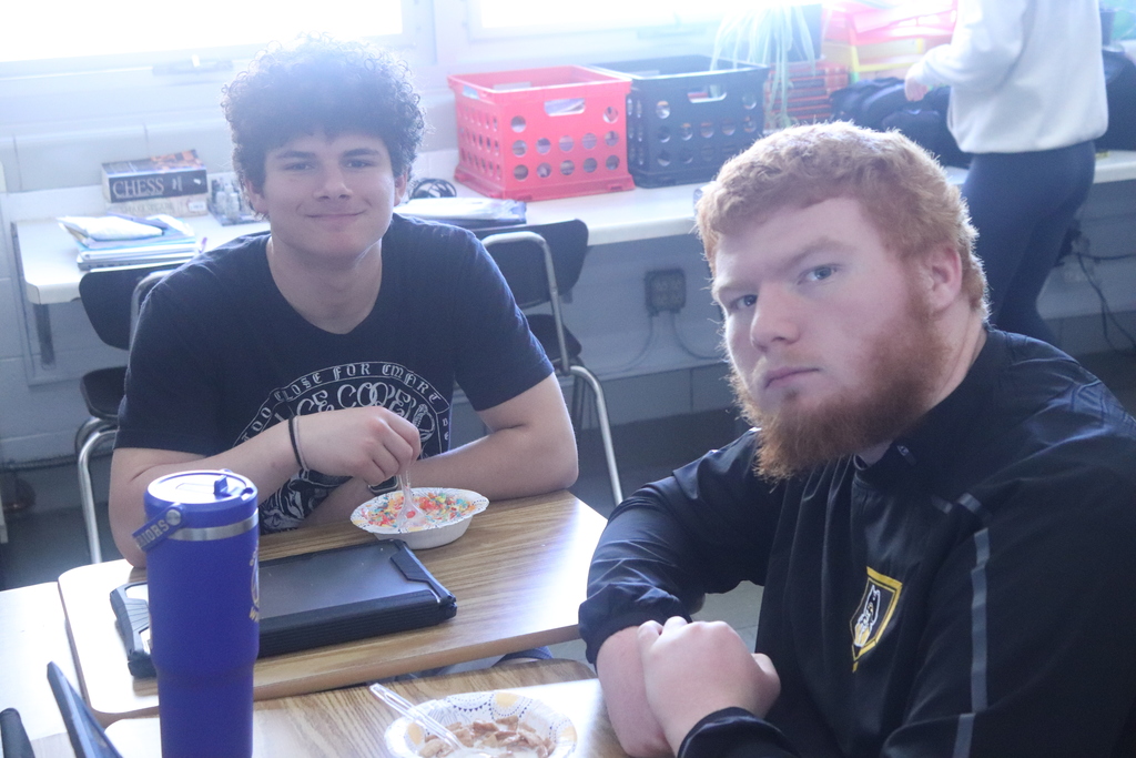 students eating cereal and posing