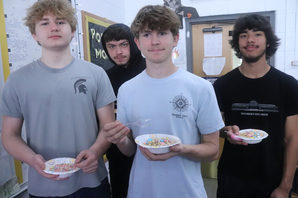 students eating cereal and posing