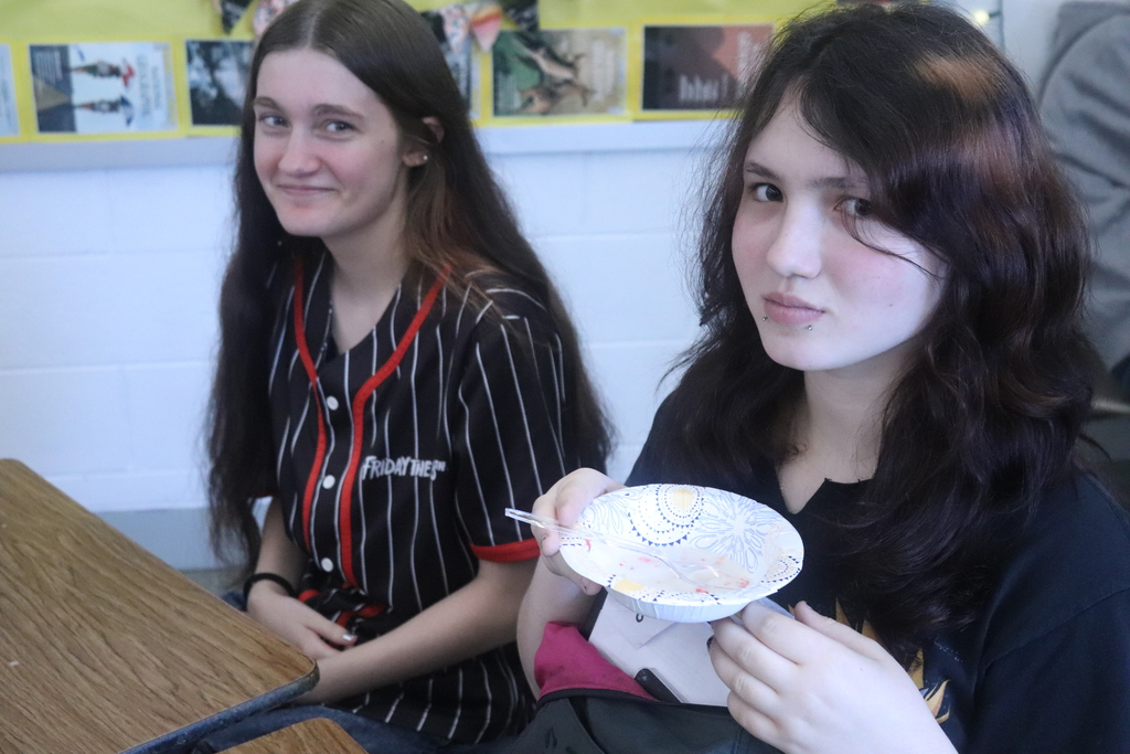 students eating cereal and posing