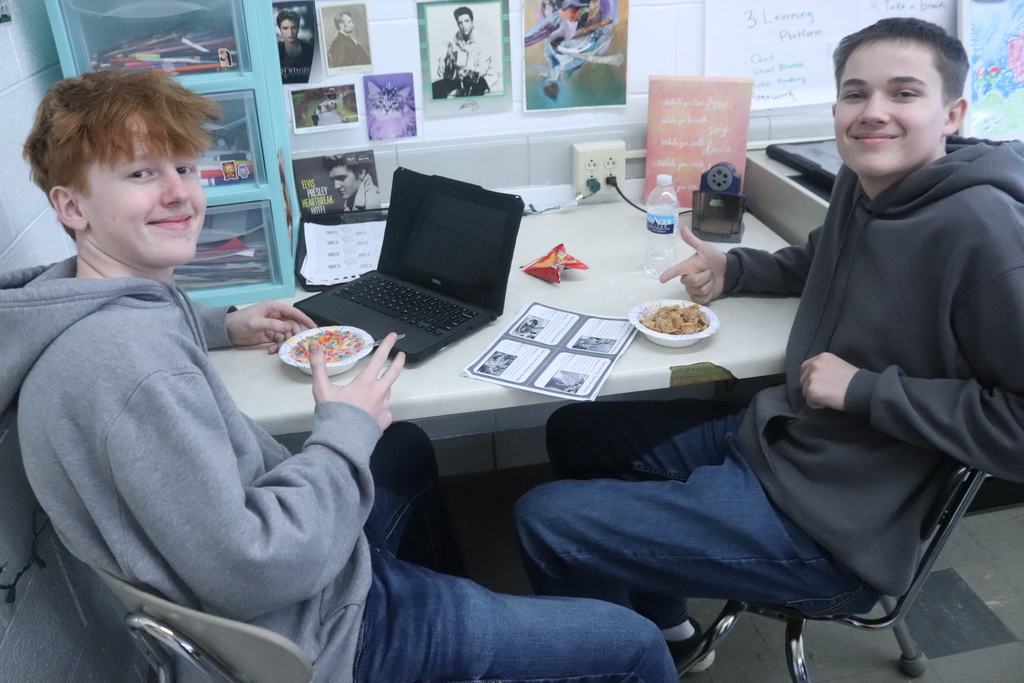 students eating cereal and posing