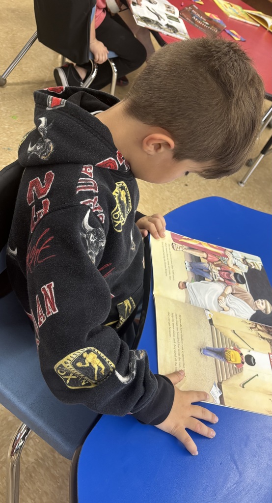 male student reading a table.