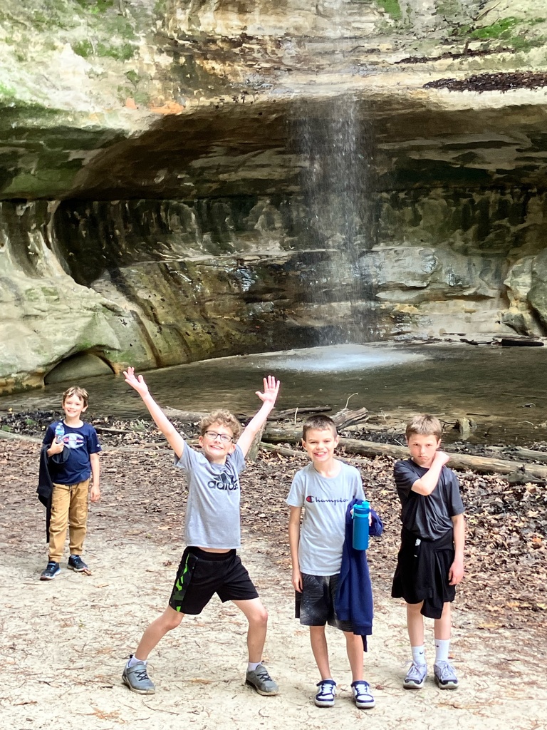 group of 4 boys smiling at the camera
