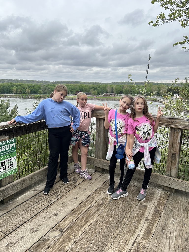 group of 4 girls posing on the pier