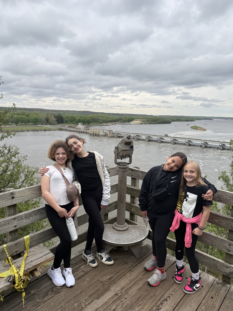 group of 4 girls posing on the pier