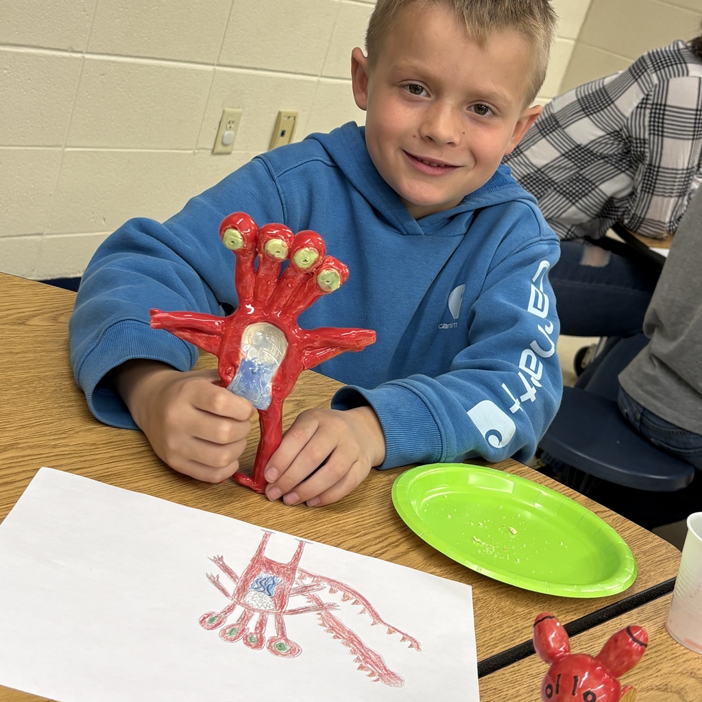 student with red four eyed monster