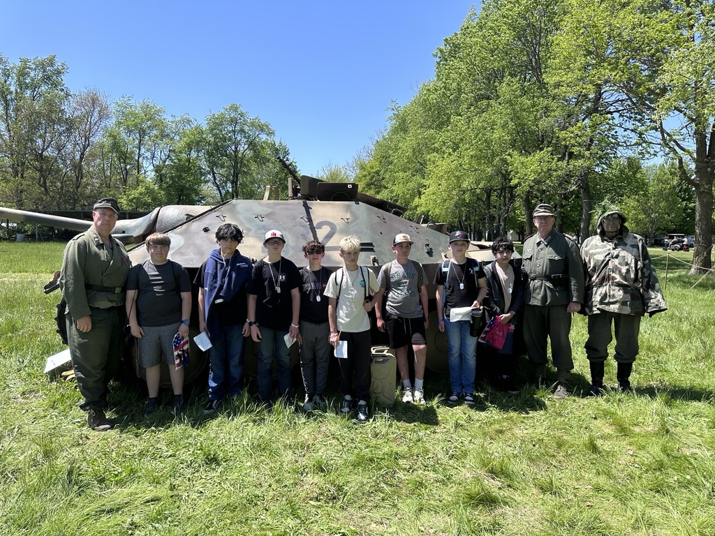 students posing with reenactment actors