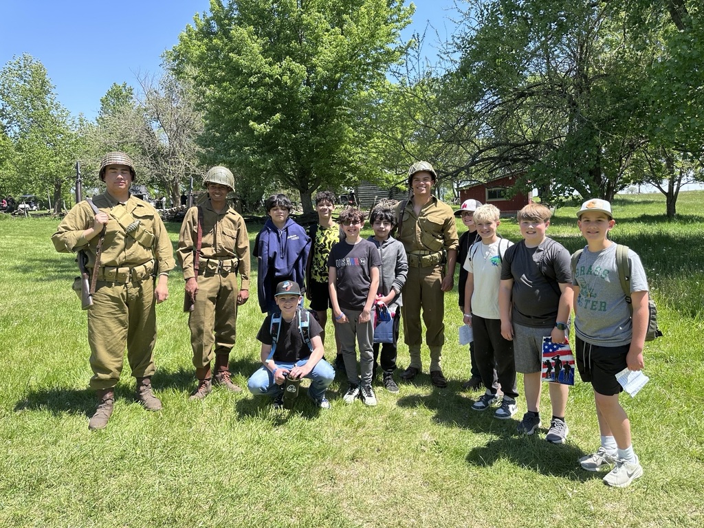 students posing with reenactment actors