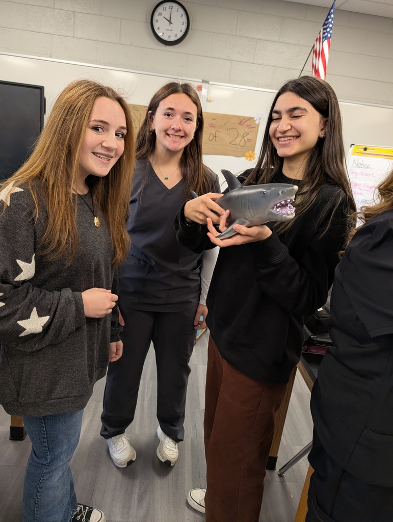 3 students with a shark!