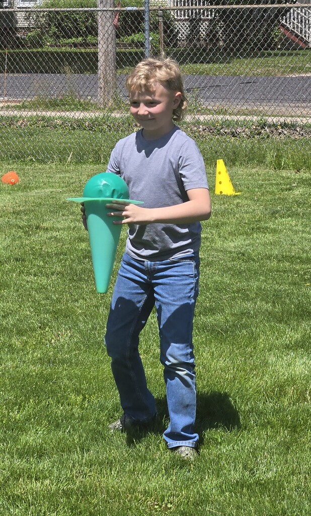 male student outside playing
