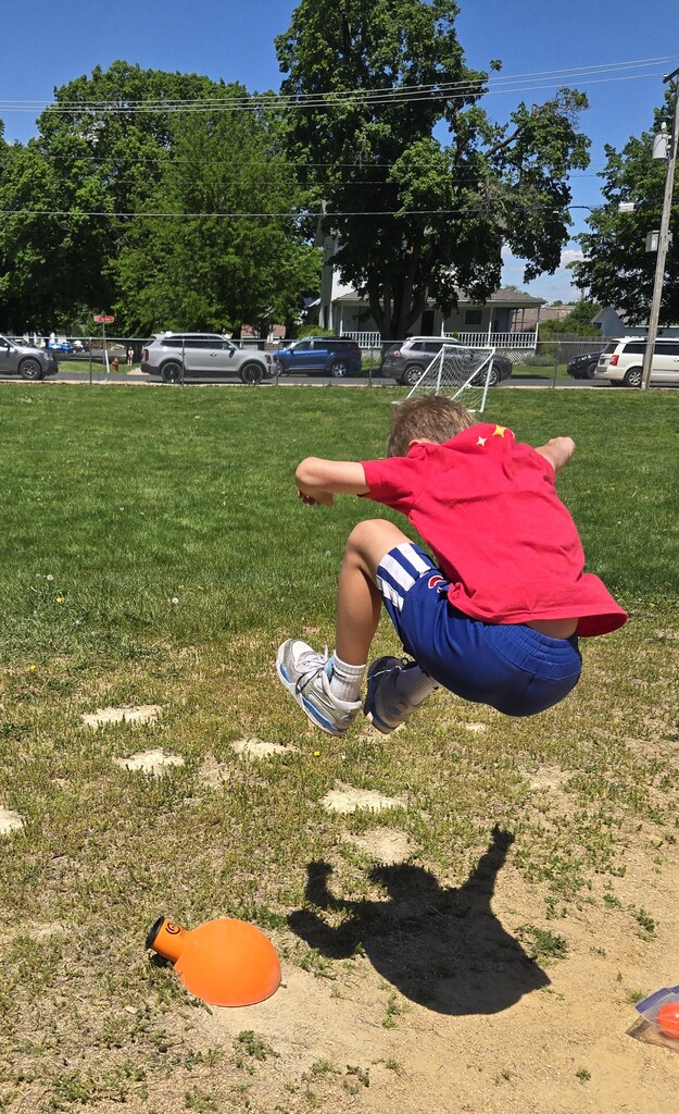 male student outside playing