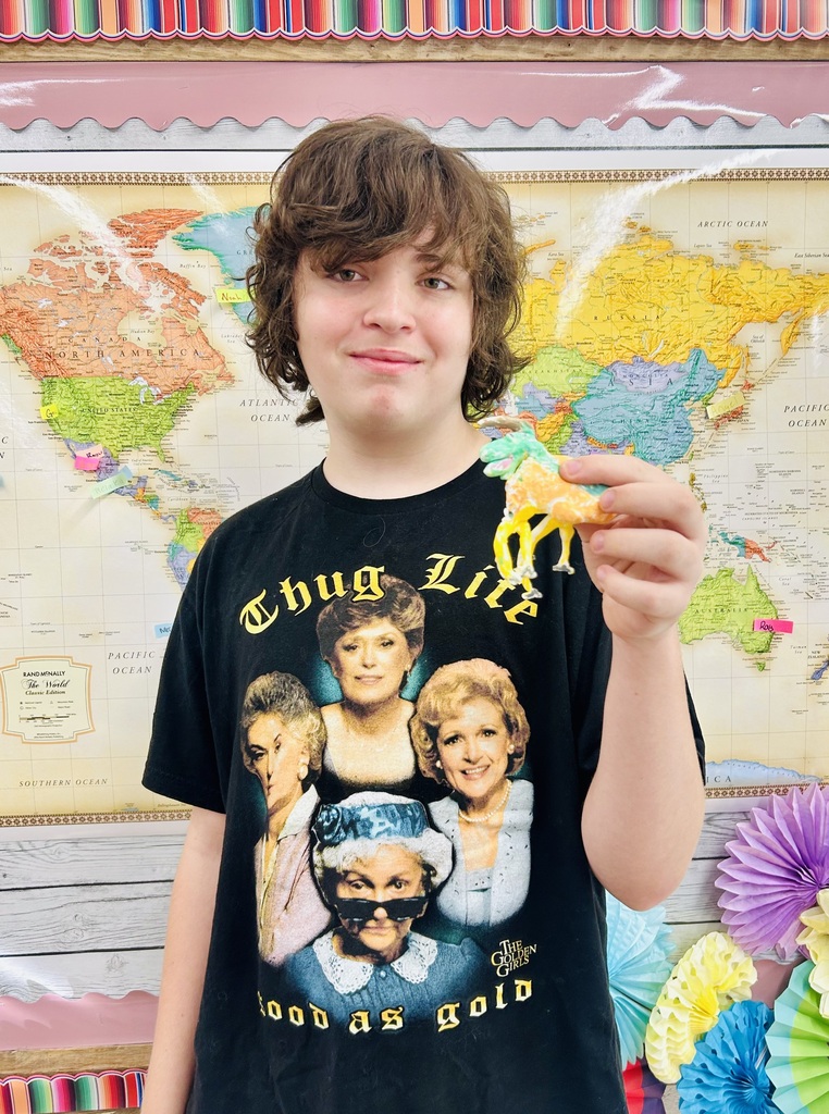 student holding  Alebrijes