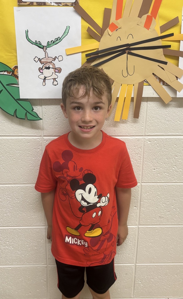 student in front of animal art