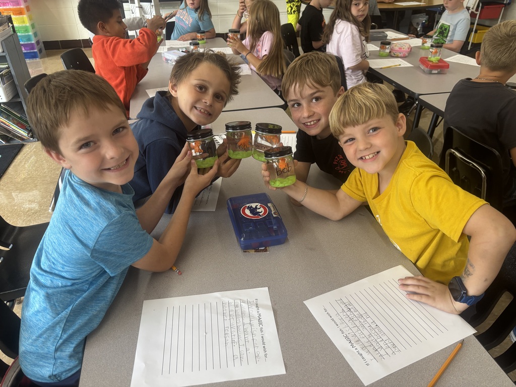 group of students posing with their magical fish