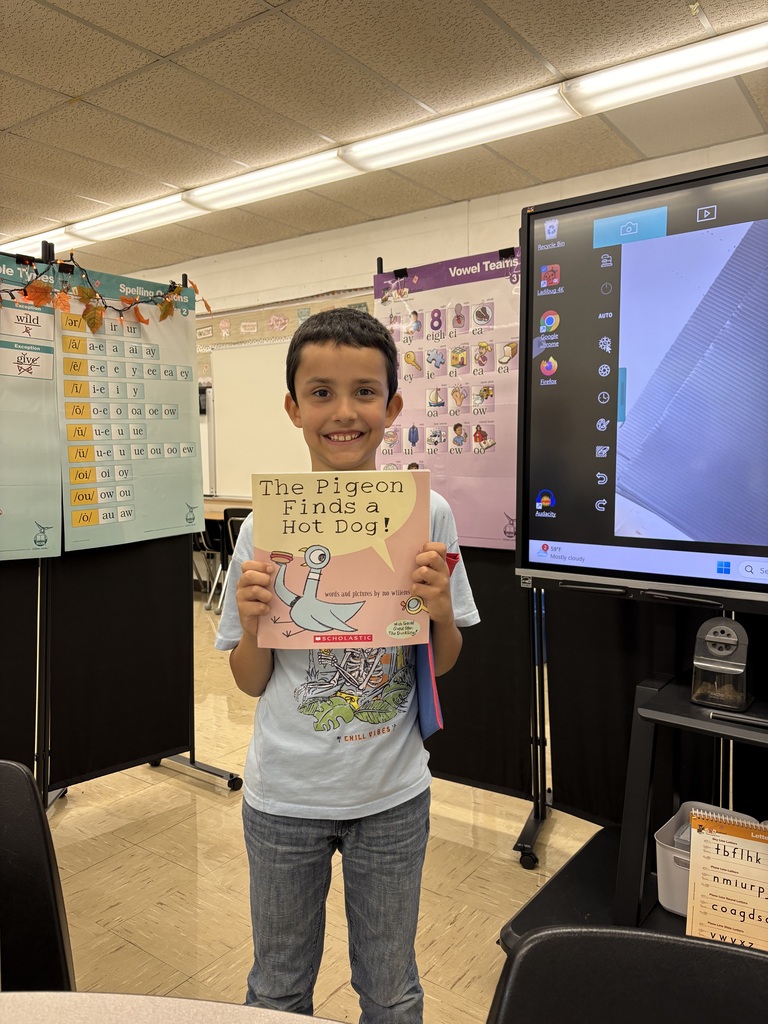 student holding book