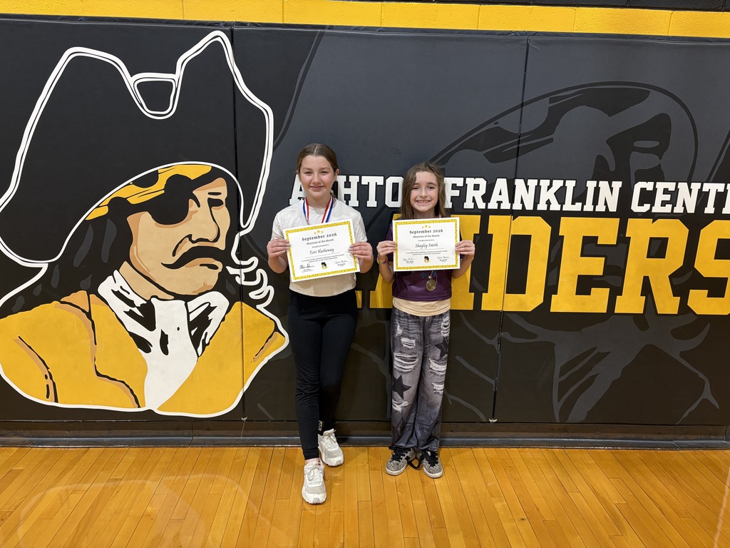 students posing with certificate