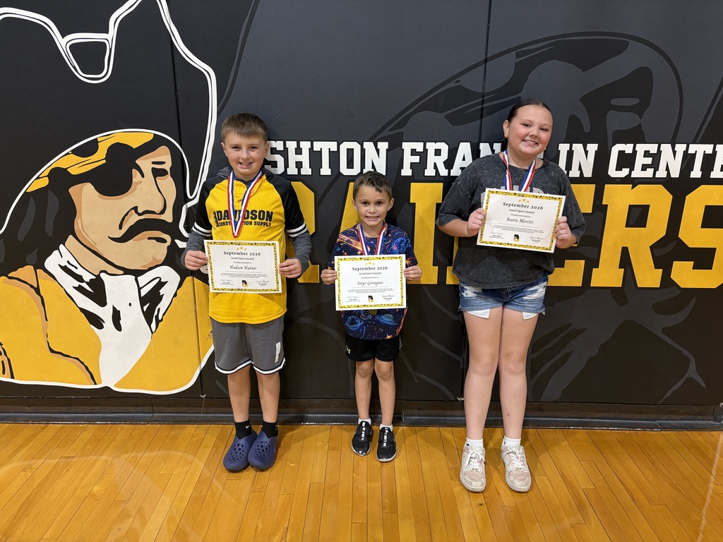 students posing with certificate