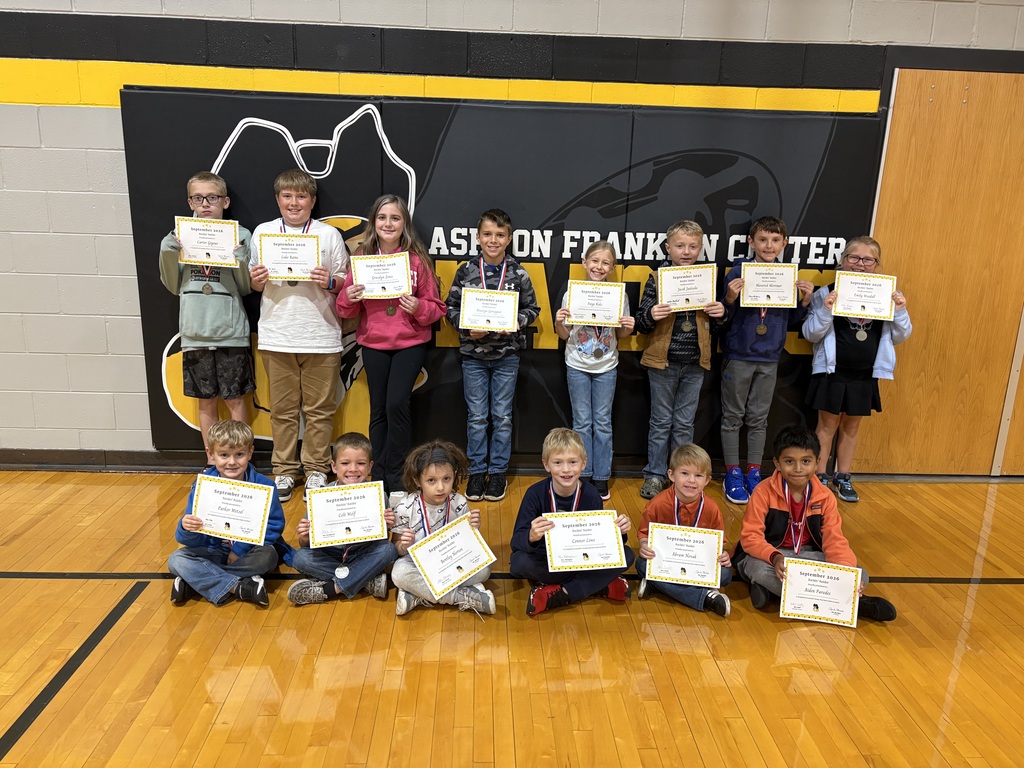 students posing with certificate
