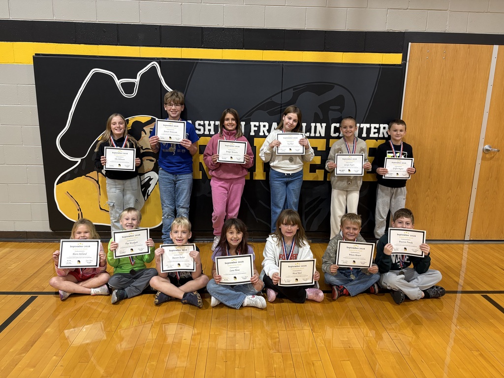 students posing with certificate