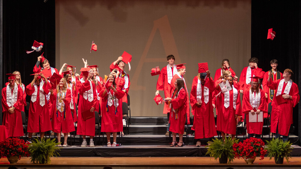 The Afton Central School Class of 2026 throws their caps in the air at the conclusion of their graduation ceremony