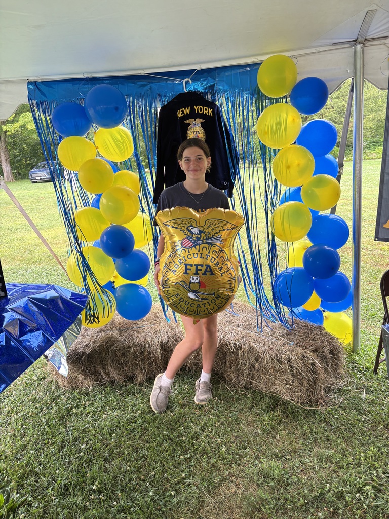 Afton student with balloon at FFA booth
