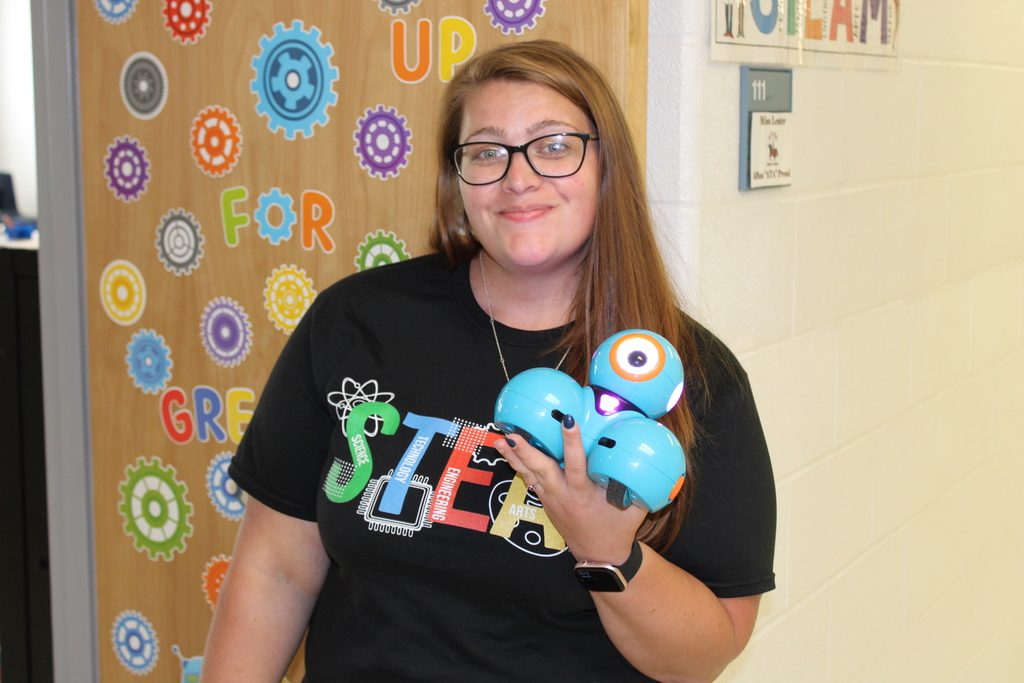 Afton teacher with a robot