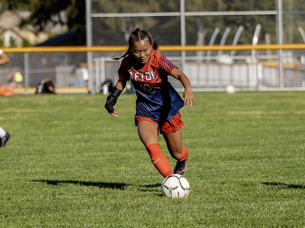 Afton player with the ball