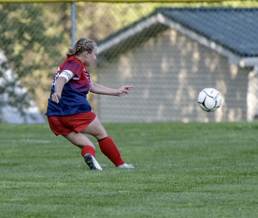 Afton player making a kick