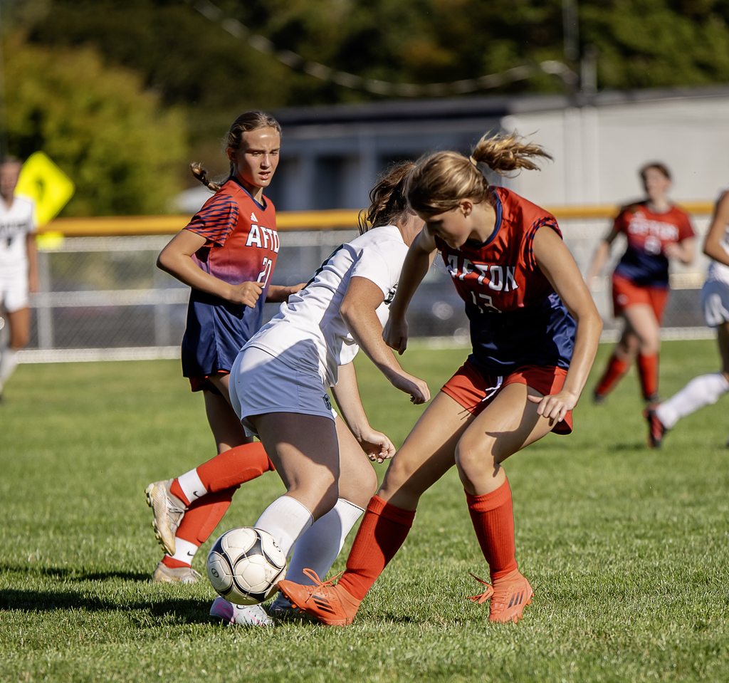 Afton soccer player in action stealing the ball