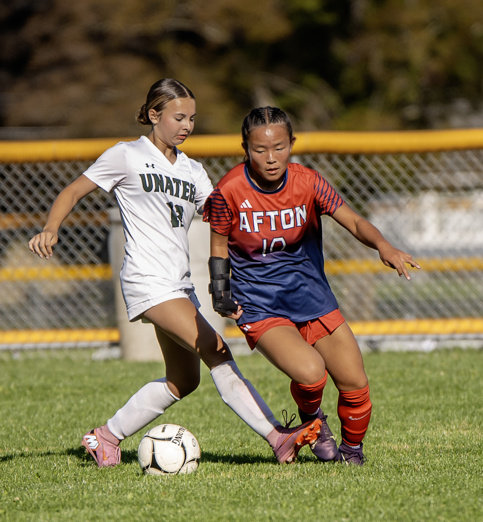 Afton player with the ball