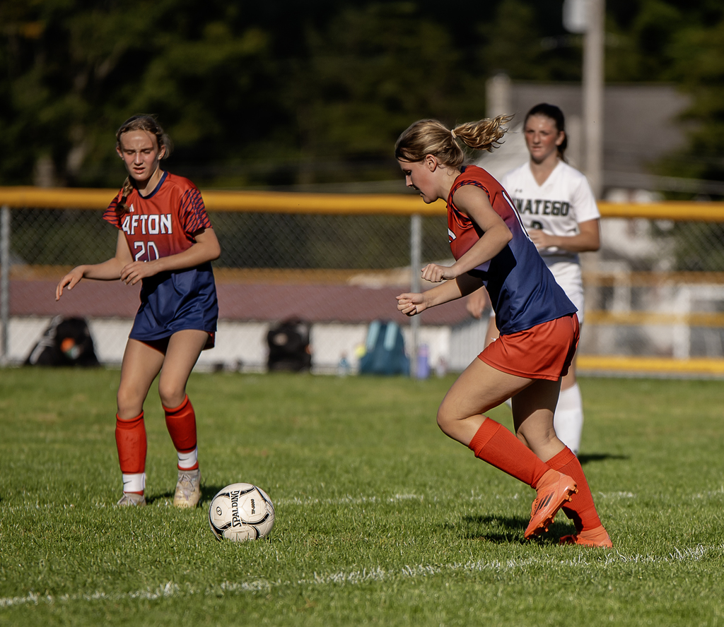 Afton Player kicking the ball