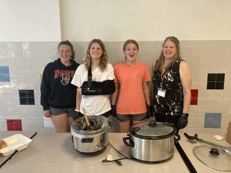 students and teacher with crock pots