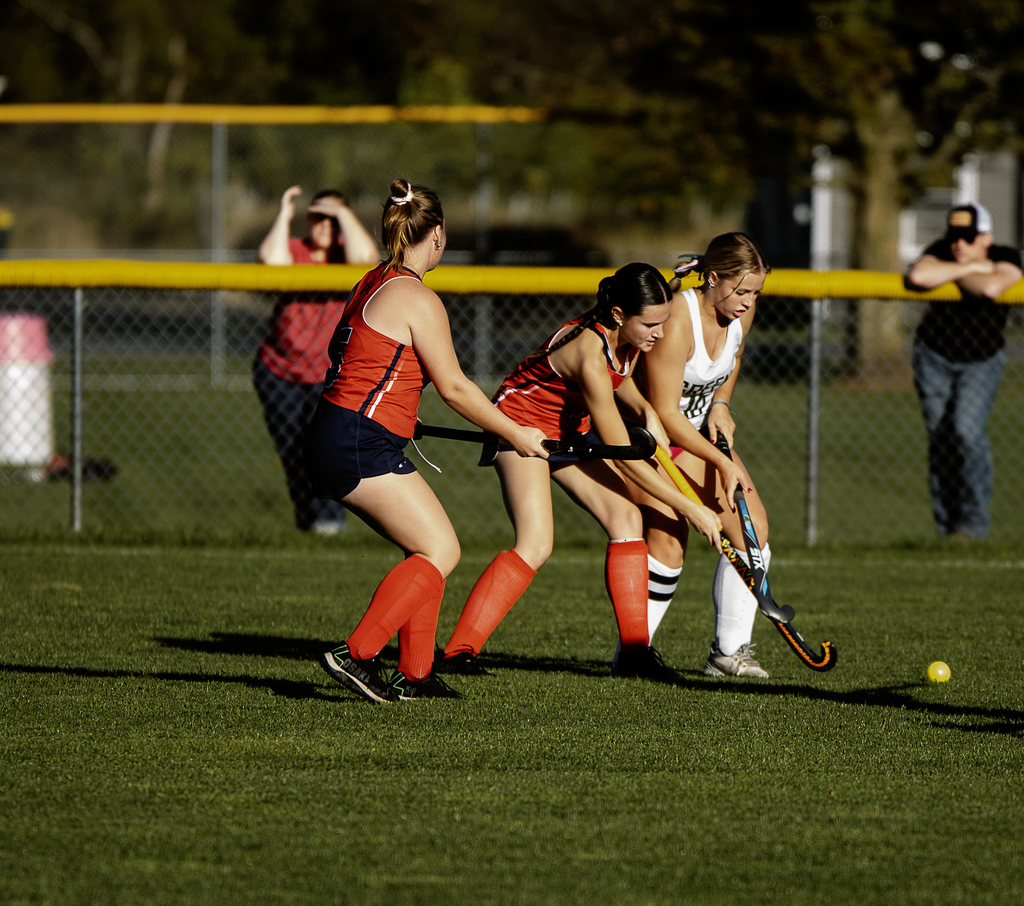 Afton players competing with Green player for the ball