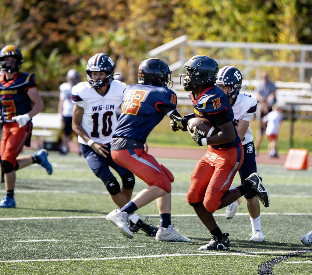 Football player running the ball