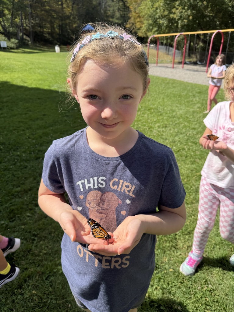 Afton student with a butterfly