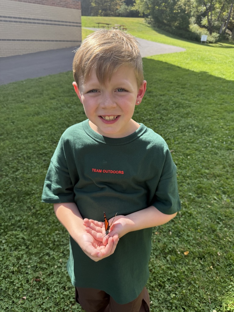 Afton student with a butterfly