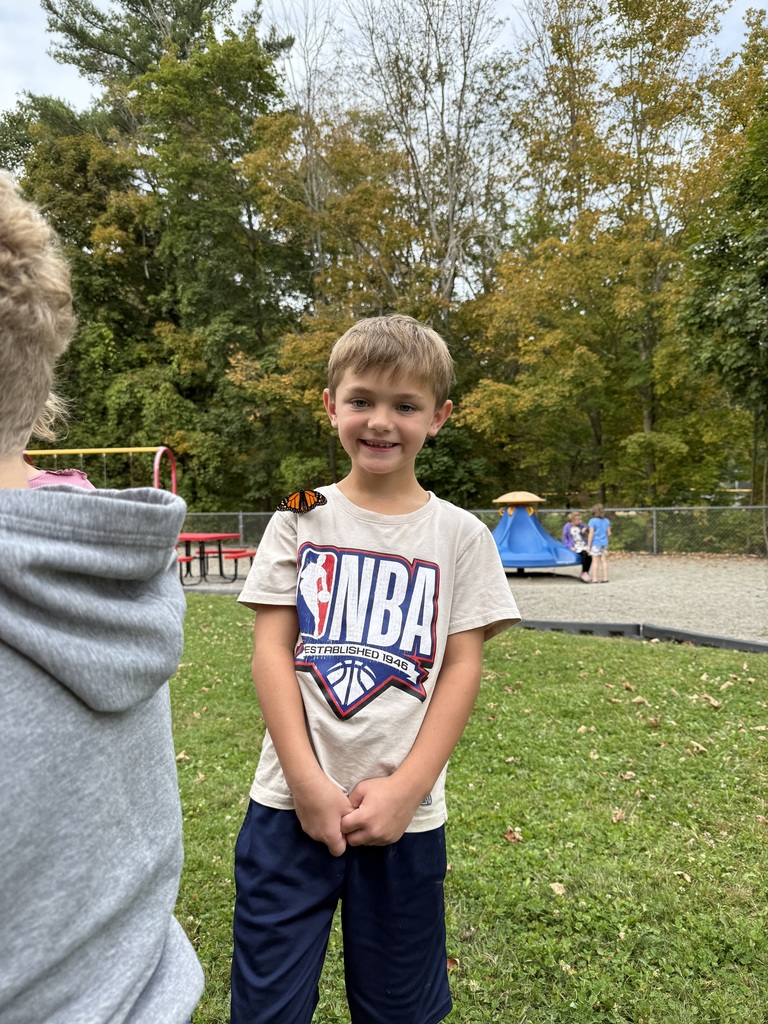Afton student with a butterfly
