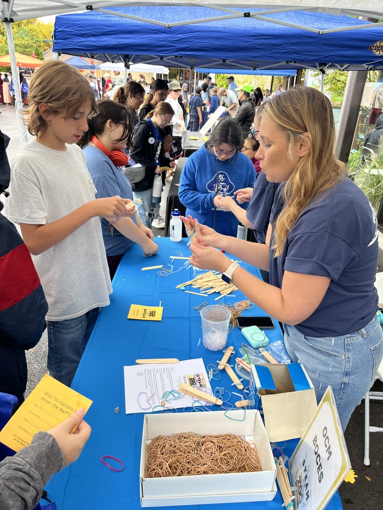Students interacting with booth representatives
