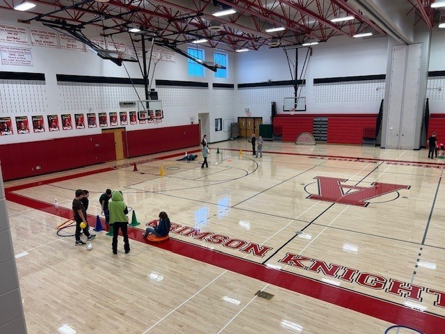 Students playing in the gym