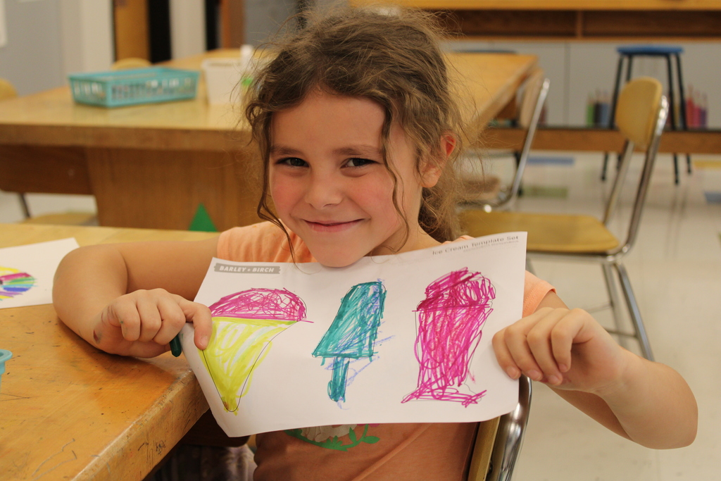 Student with colored artwork